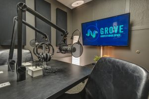 Podcast studio with Microphones, Headphones, TV, and chairs